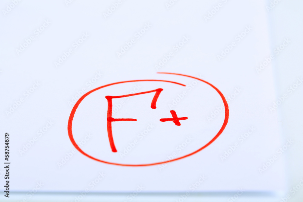 Grade F+ written on an exam paper Grade F+ written on an exam paper
