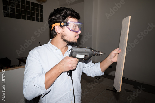 young man bricolage working