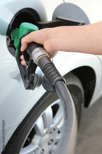 Gas Station Refill Hand and Nozzle