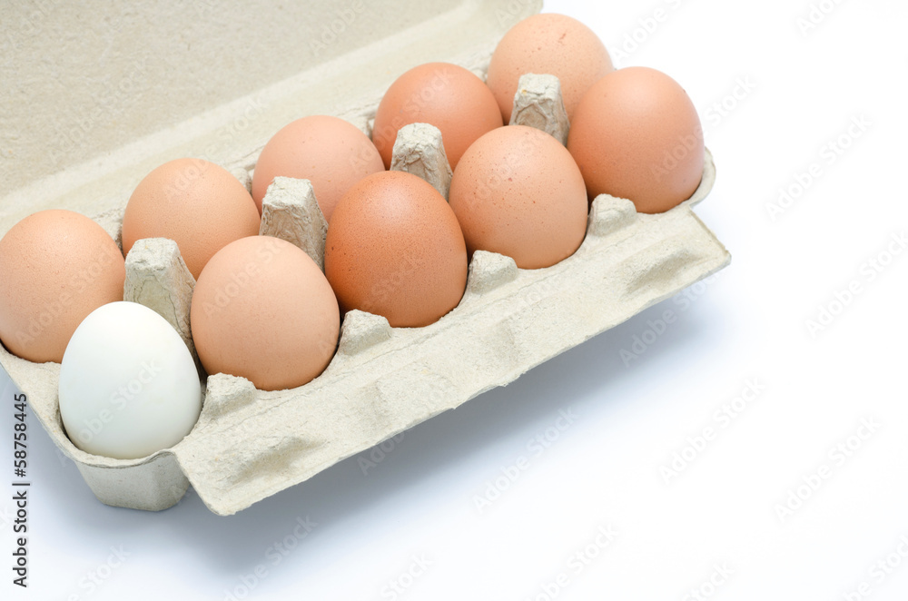 white and brown eggs in a carton package white and brown eggs in a carton package