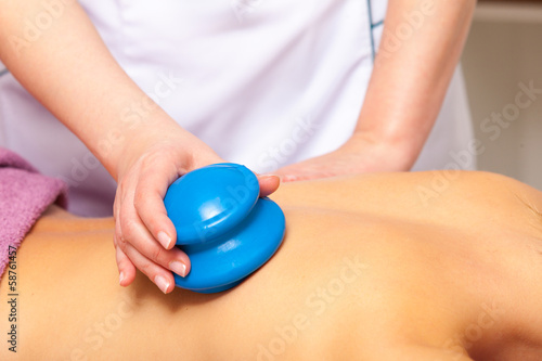 Beauty salon. Woman getting spa cupping glass vacuum massage