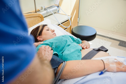 Man s Hand Consoling Pregnant Wife Lying On Hospital Bed