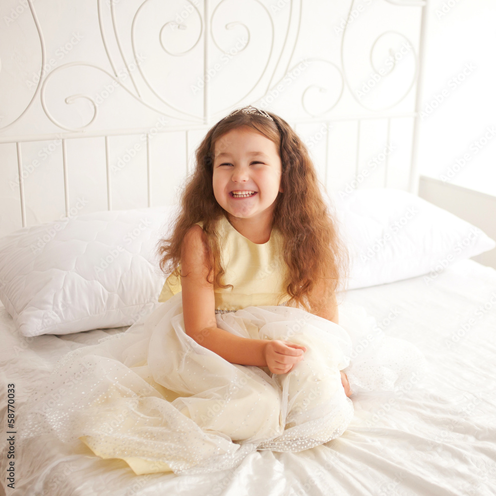 Happy smiling child waking up in the morning. Happy smiling child waking up in the morning.