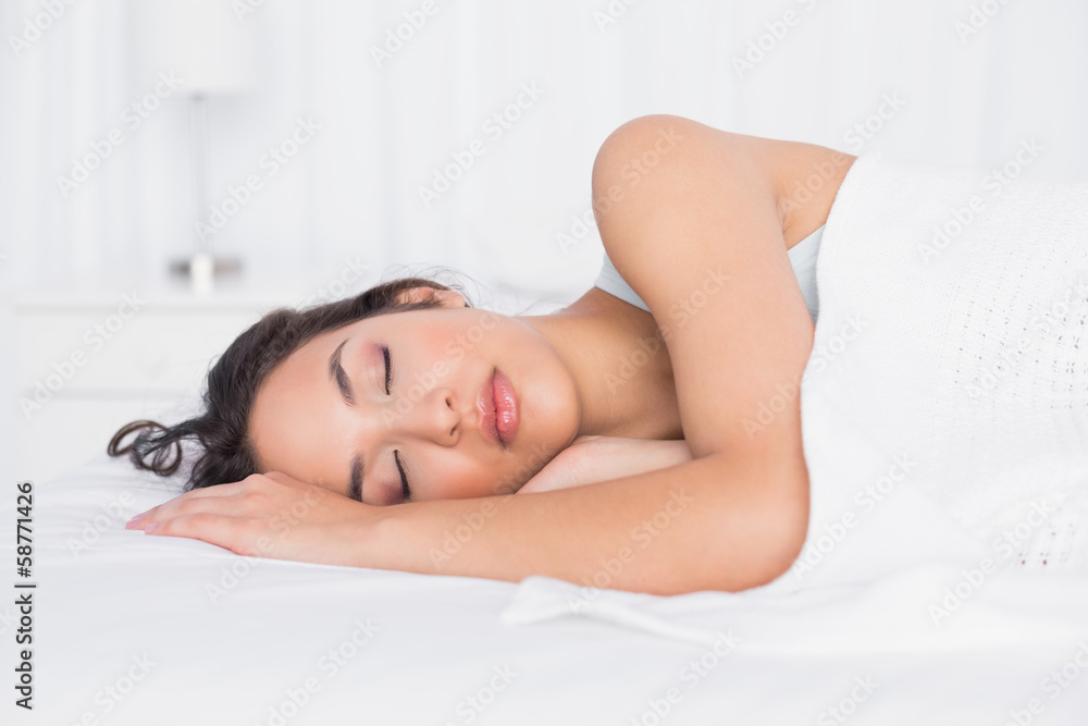Pretty young woman sleeping with eyes closed in bed Pretty young woman sleeping with eyes closed in bed