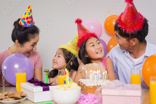 Fotografiet Family with cake and gifts at a birthday party