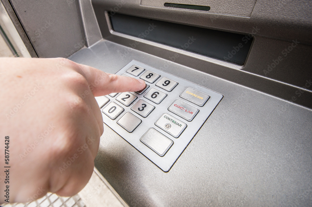 Finger pressing password number on ATM machine