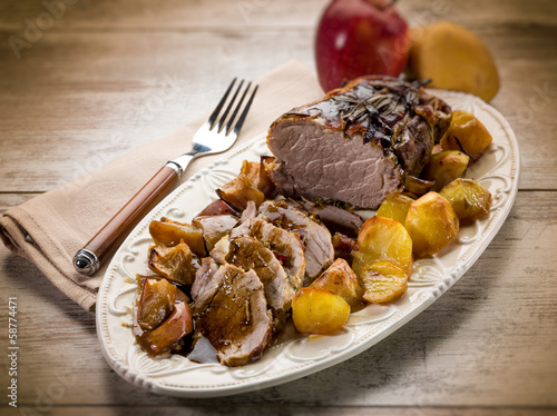 roast  with potatoes and apple, selective focus photo