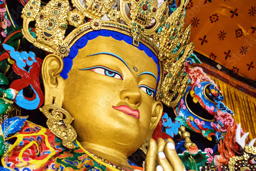 Buddha maitreya statue  close up in a monastery photo