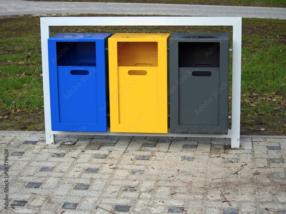 Set of colorful waste baskets in metal frame Set of colorful waste baskets in metal frame