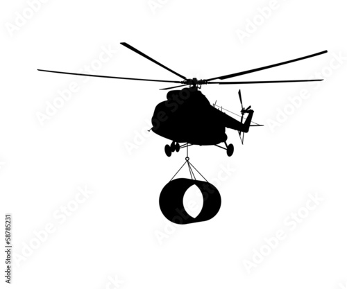 Silhouette of the helicopter with the load.