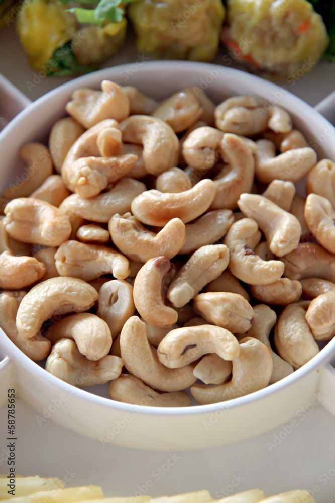 Cashews in white dish. Cashews in white dish.