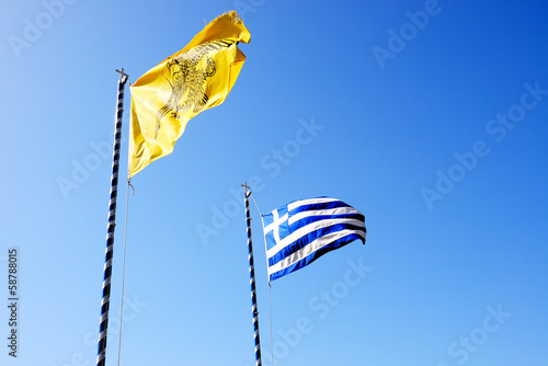 The Greek Flag and Flag of Varlaam monastery, Meteora, Greece photo