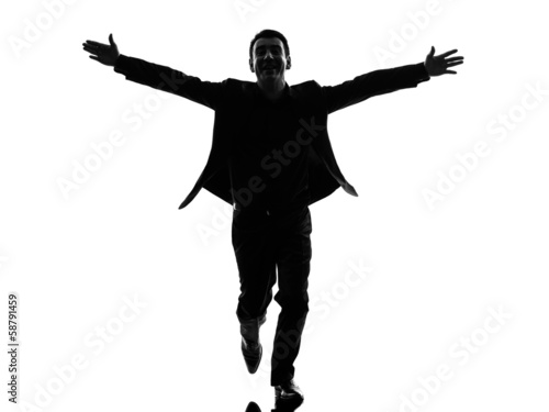business man arms outstretched silhouette