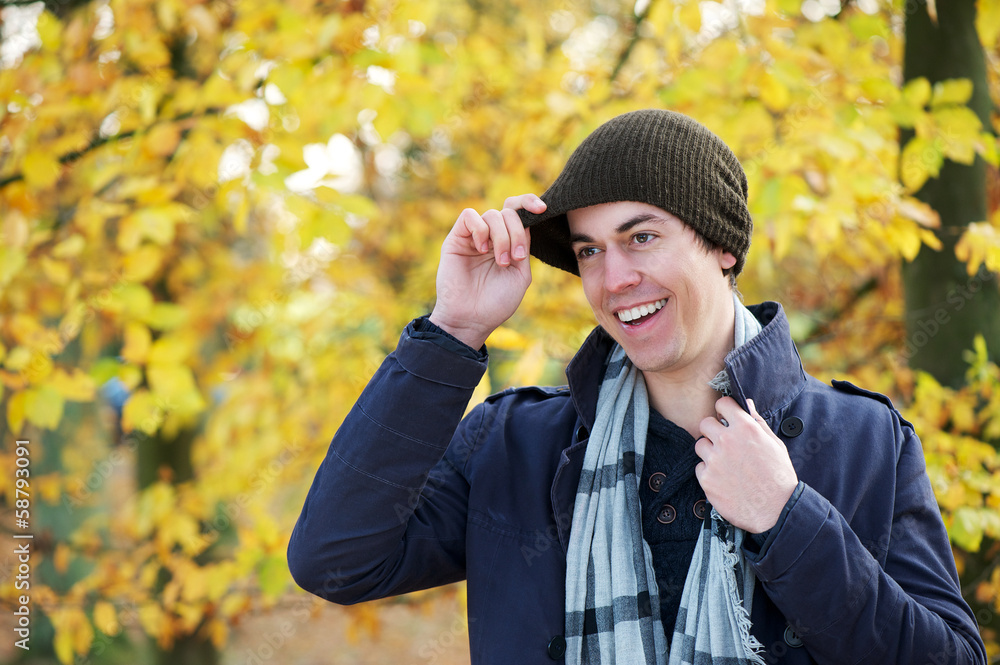 Portrait of a man smiling outdoors in warm clothing Portrait of a man smiling outdoors in warm clothing