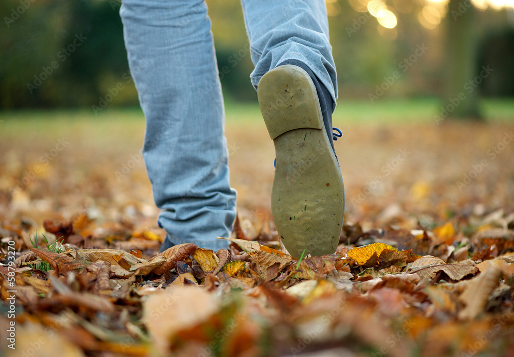 Walking with boots on autumn leaves Walking with boots on autumn leaves