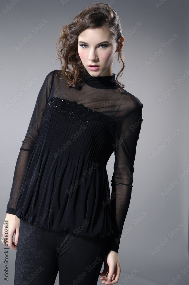 fashionable girl standing in the studio fashionable girl standing in the studio