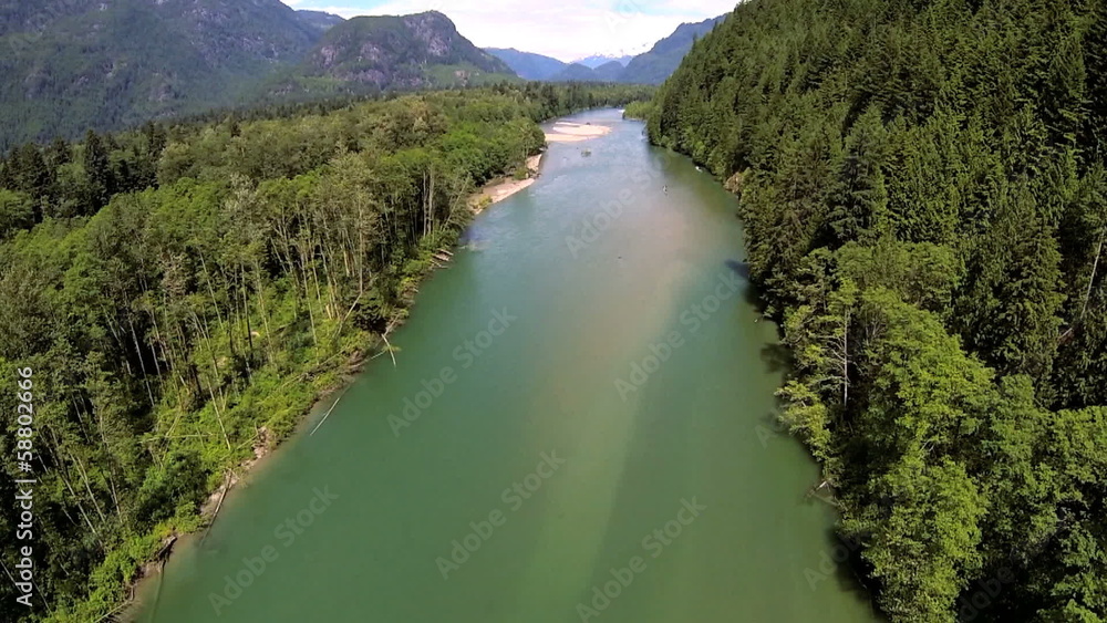 Aerial view of conifer wilderness river remote area, USA Aerial view of conifer wilderness river remote area, USA