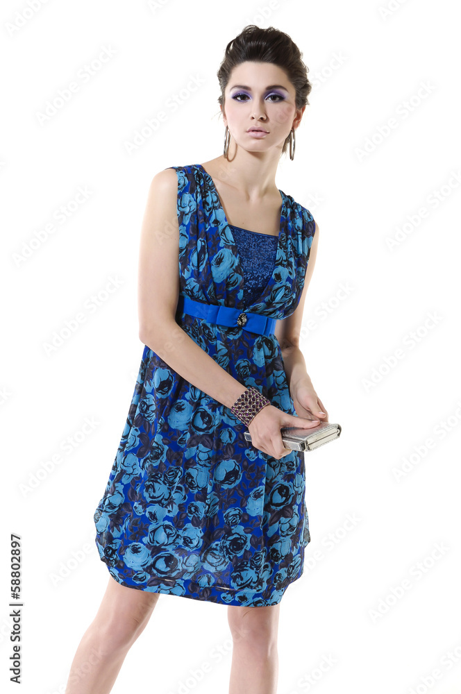 Portrait of beautiful young girl holding purse posing Portrait of beautiful young girl holding purse posing