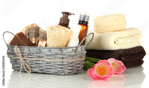 Fototapeta Naklejka Na Ścianę i Meble -  Composition of cosmetic bottles and soap in basket, isolated