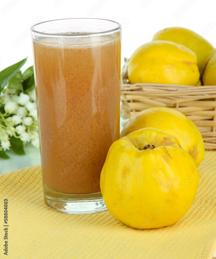 Sweet quince with juice on table on white background Sweet quince with juice on table on white background