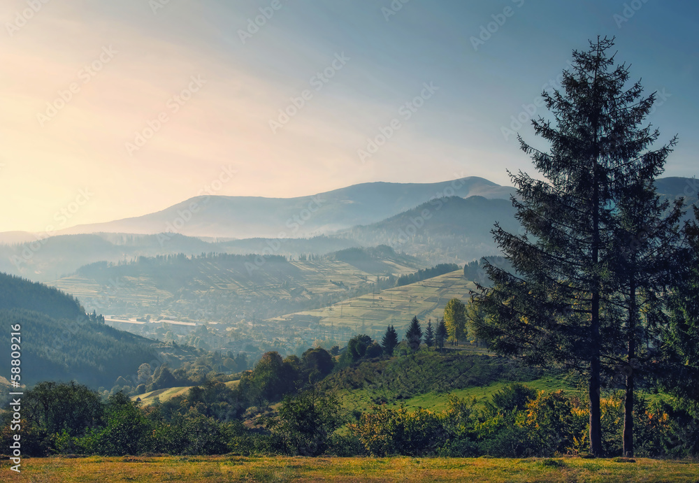 Fototapeta premium sunrise mountains and summer valley