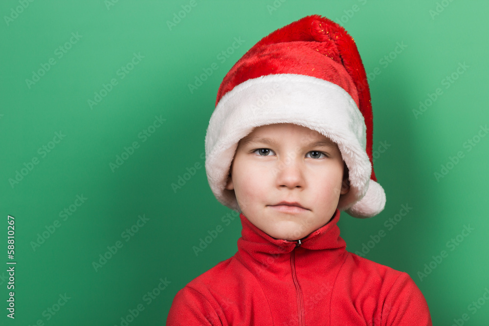Santa boy playing on green background Santa boy playing on green background