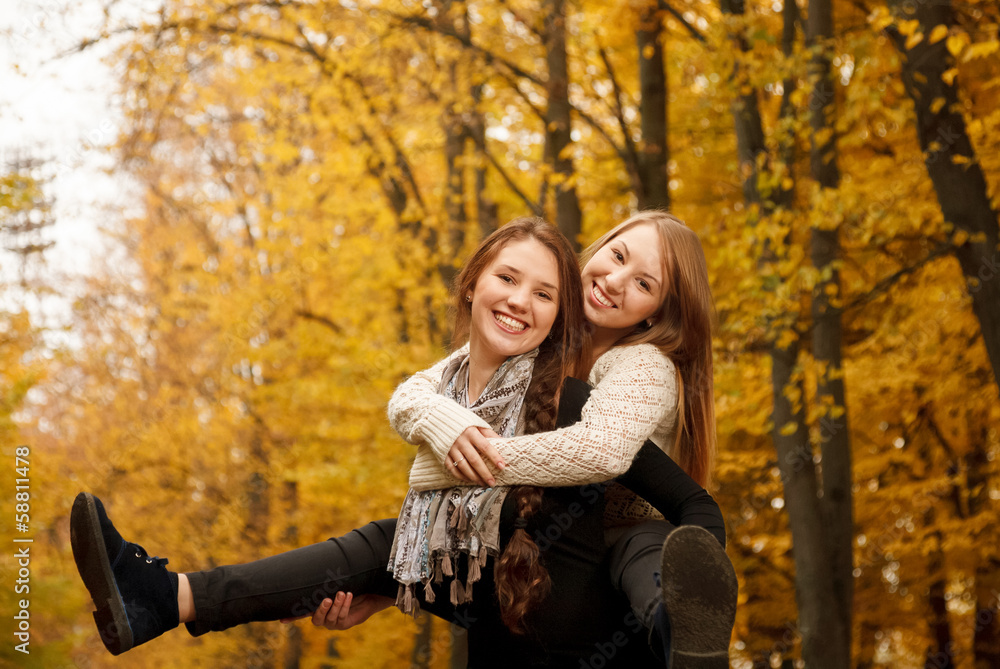 piggyback ride in autumn forest piggyback ride in autumn forest
