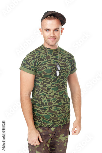 Portrait of young smiling army soldier photo