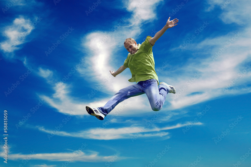 Jump of man under sky with clouds