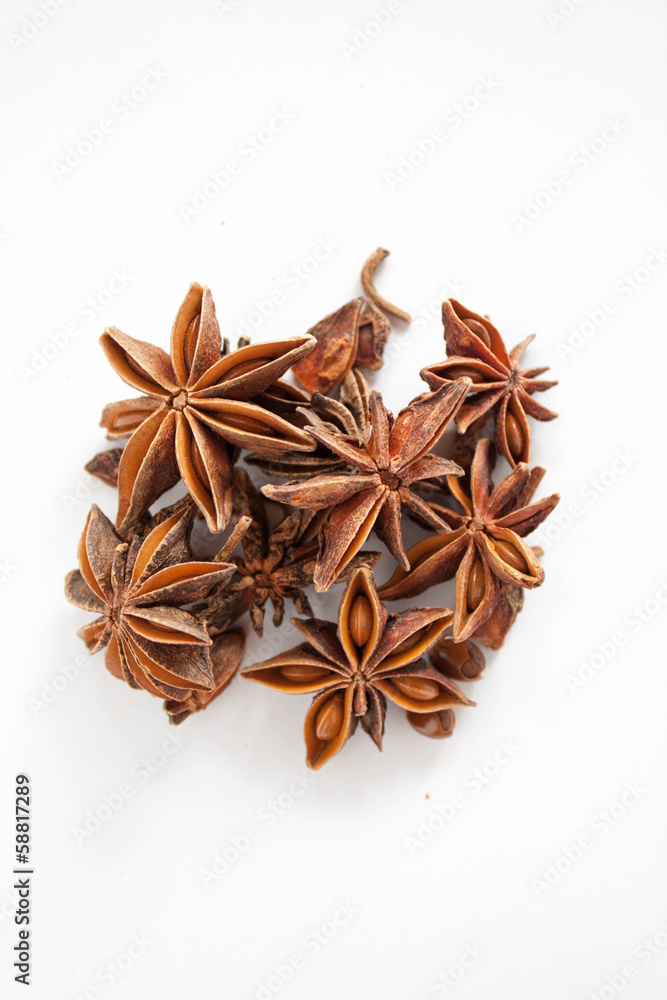 Star anise piled up on a white background. Star anise piled up on a white background.