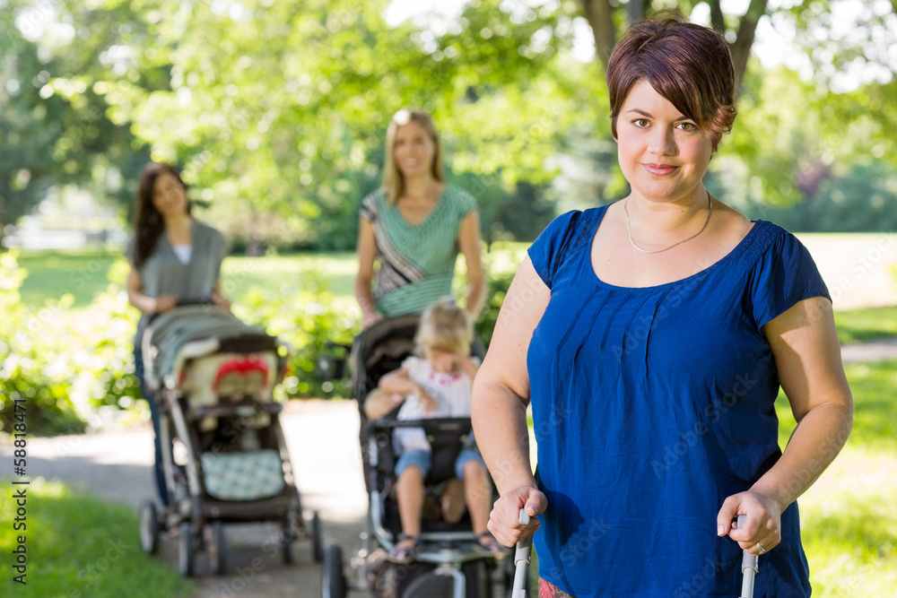Mother With Baby Stroller At Park