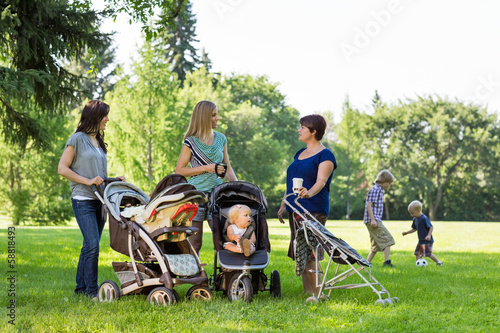 Happy Mothers With Baby Strollers