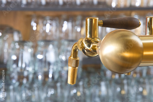 beer tap detail with handle amde from gold metal