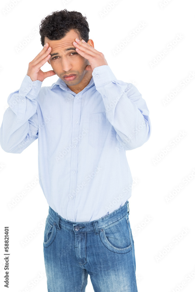 Portrait of a young man suffering from headache Portrait of a young man suffering from headache