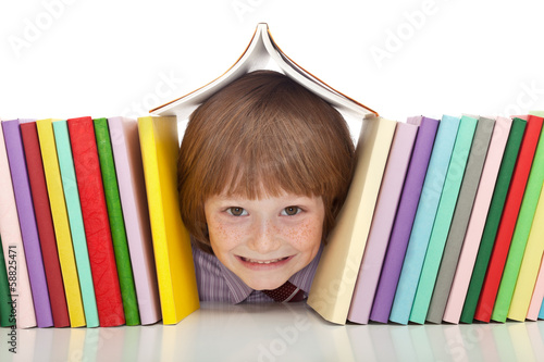 Happy boy with colorful books photo