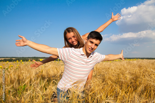 Teen couple on the wheat field
