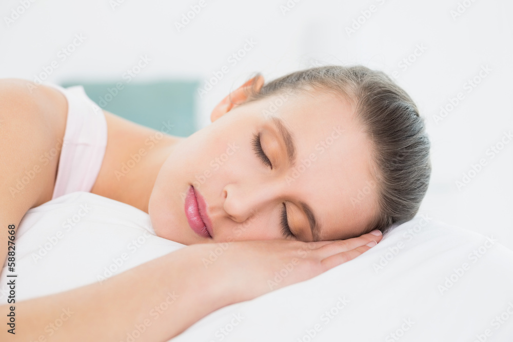Pretty woman sleeping with eyes closed in bed Pretty woman sleeping with eyes closed in bed