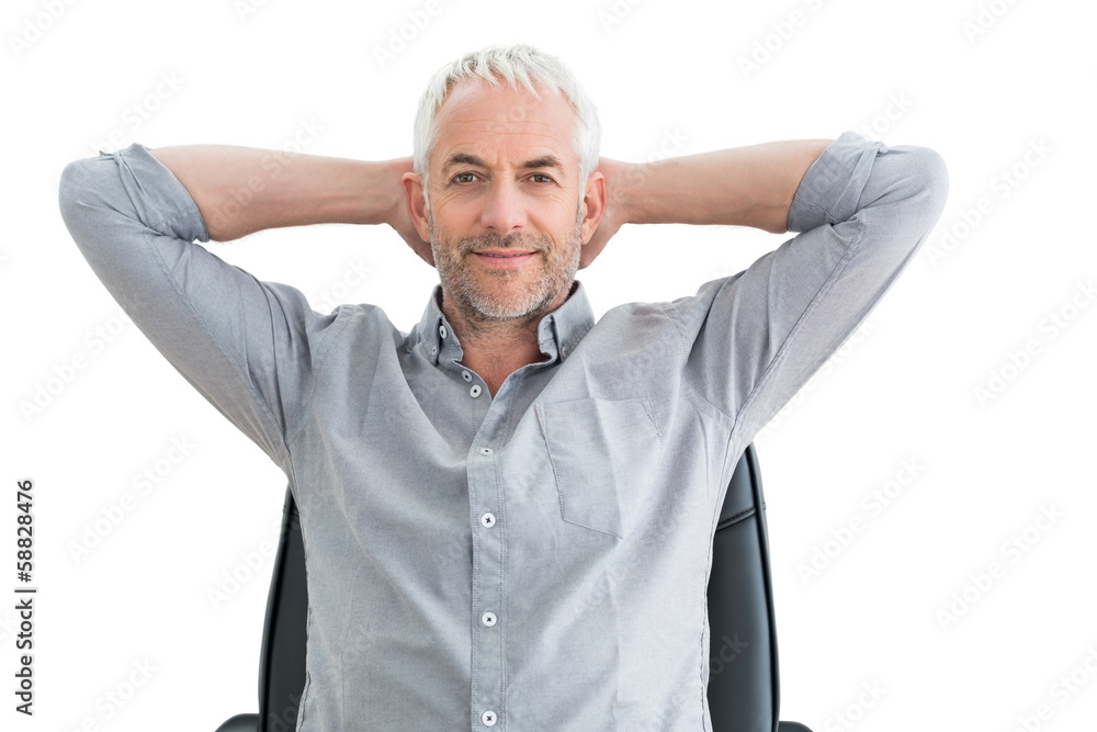 Relaxed mature businessman with hands behind head Relaxed mature businessman with hands behind head
