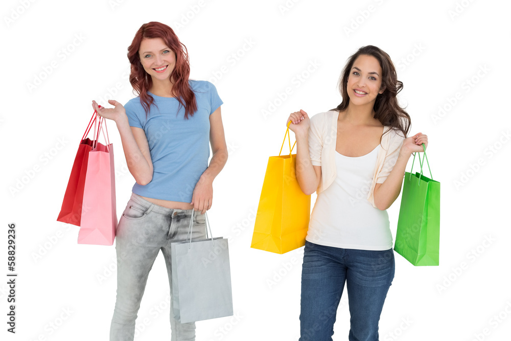 Two happy young female friends with shopping bags Two happy young female friends with shopping bags