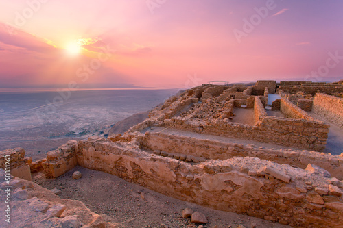 Beautiful sunrise over Masada fortress in Judaean Desert photo