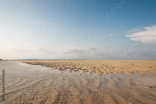 Ocean and beach with yellow sand - beautiful landscape