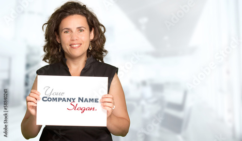 Woman presenting a blank si...