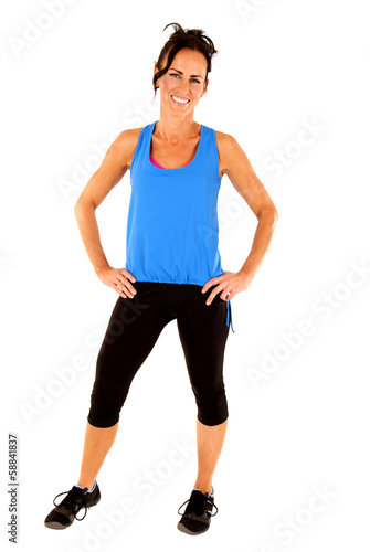 smiling fit toned female fitness model standing