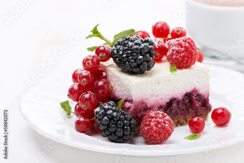 piece of cheesecake with fresh berries and coffee