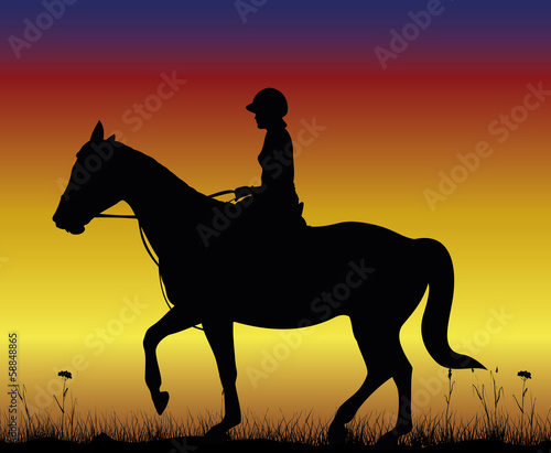 girl on horse - dressage on the backdround of sunset