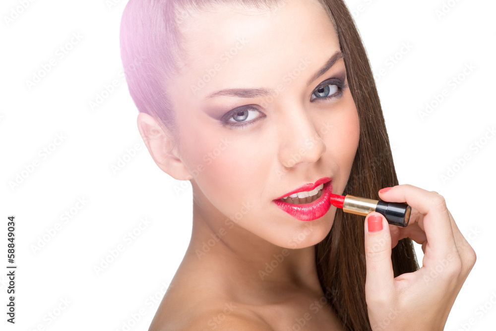 Beautiful fair skinned woman using a red lipstick Beautiful fair skinned woman using a red lipstick