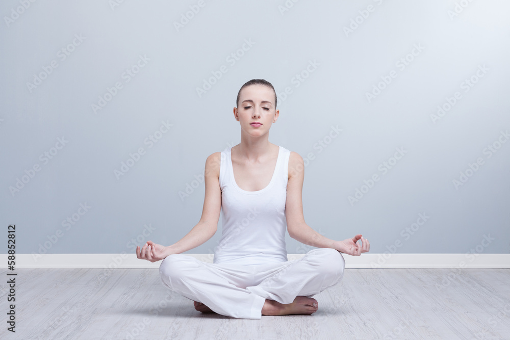 Young female doing yoga