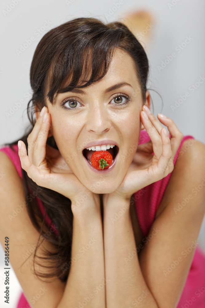 Woman eating strawberries Woman eating strawberries