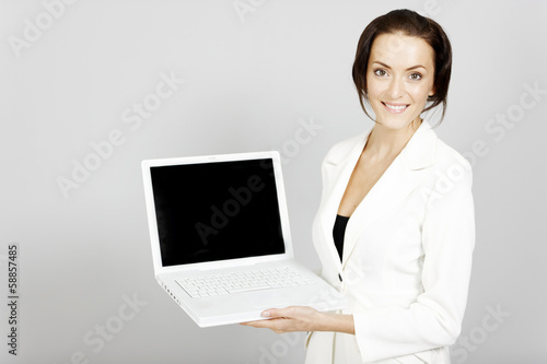 woman holding laptop