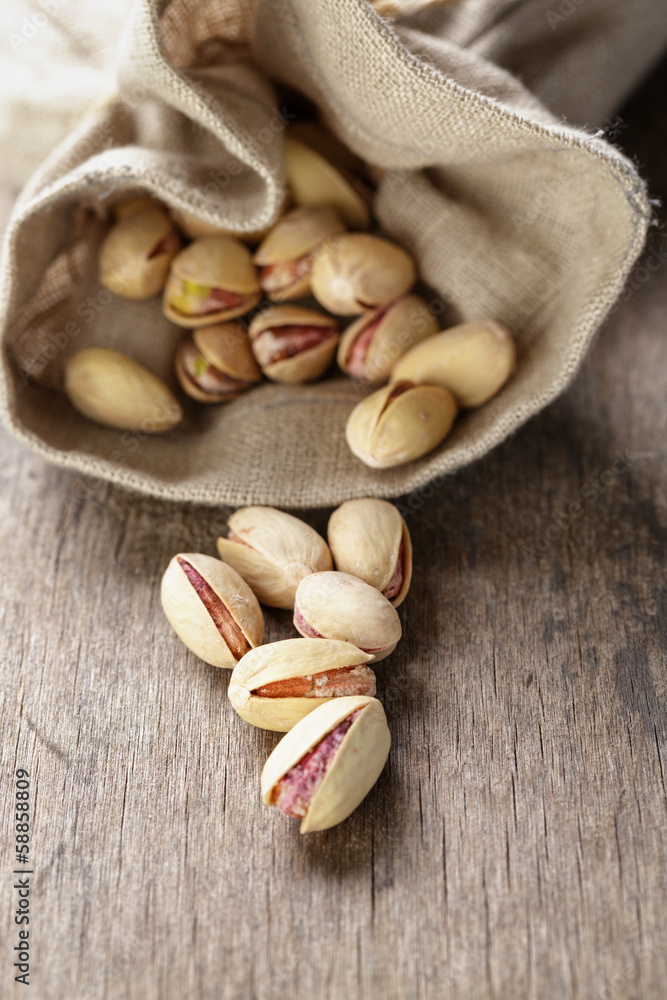 roasted and salted pistachios pour out of the bag roasted and salted pistachios pour out of the bag